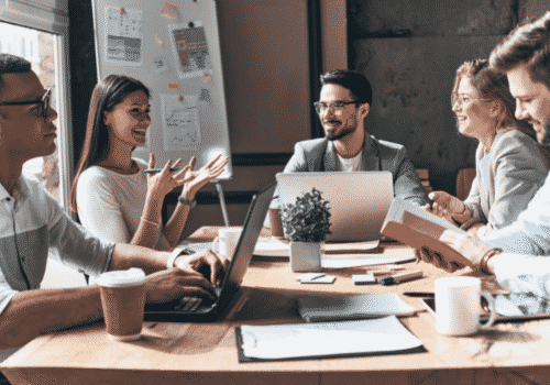 A team meeting around a conference room talking planning for an upcoming event.