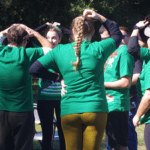 JMCOlympics green team huddle