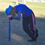 Stacy Dreher doing the dizzy bat challenge.